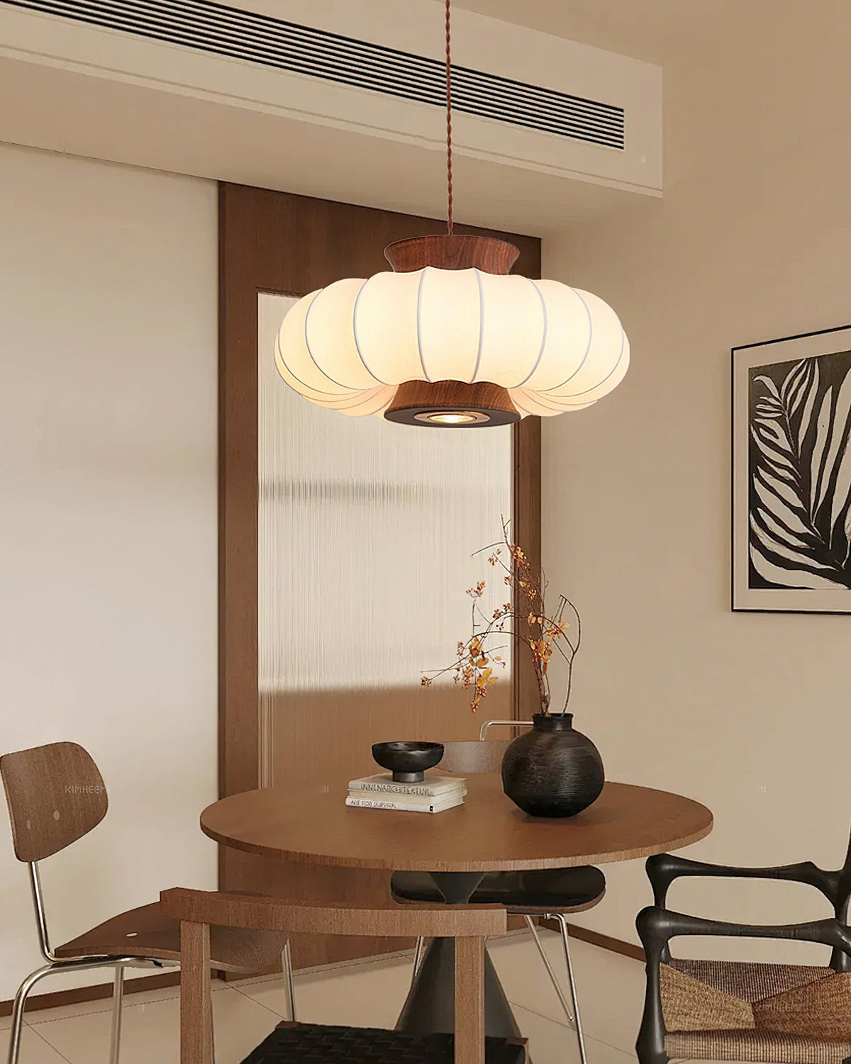 The Aeron Pendant Light illuminating a dining area.
