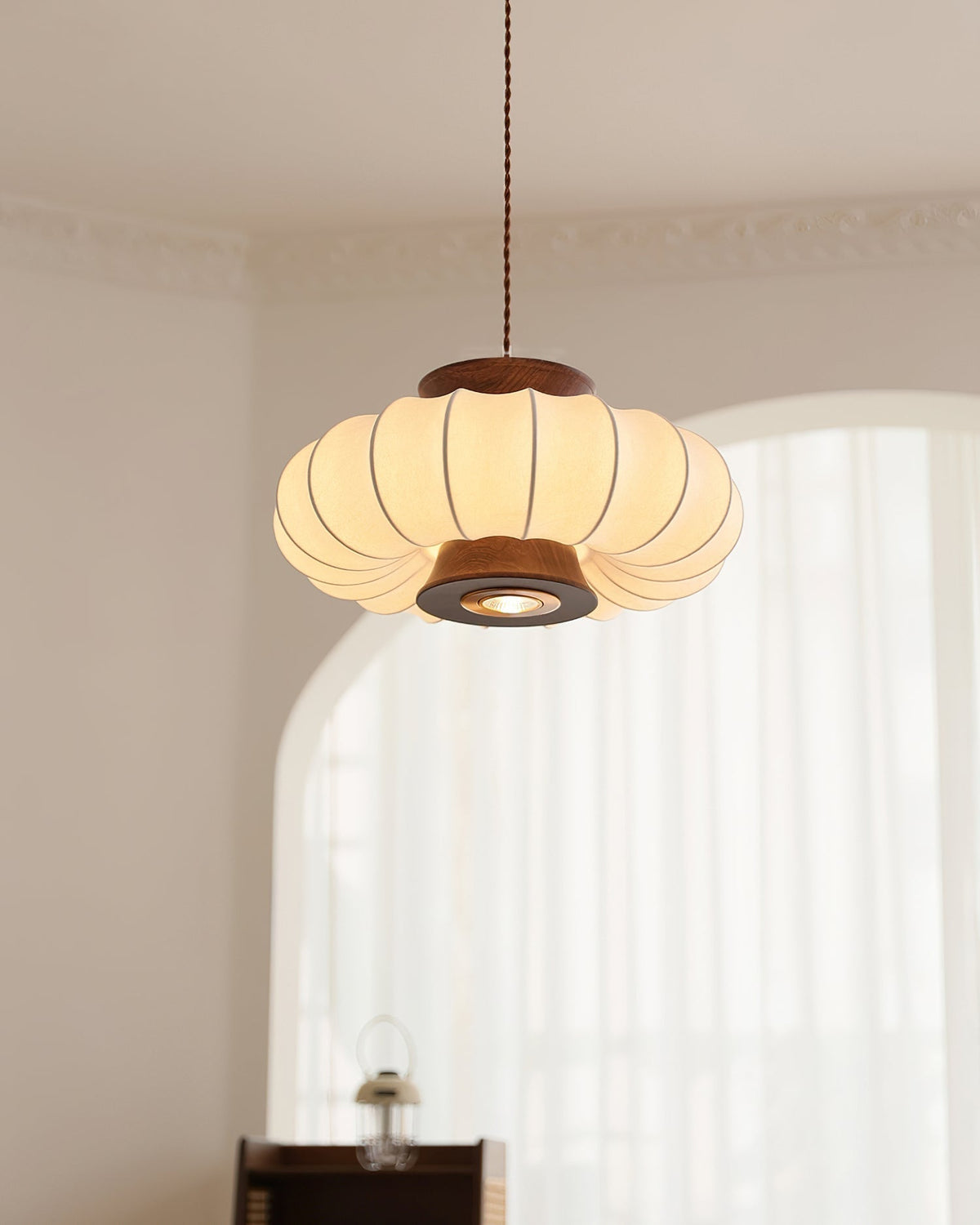 Aeron Pendant Light shown against a neutral wall.