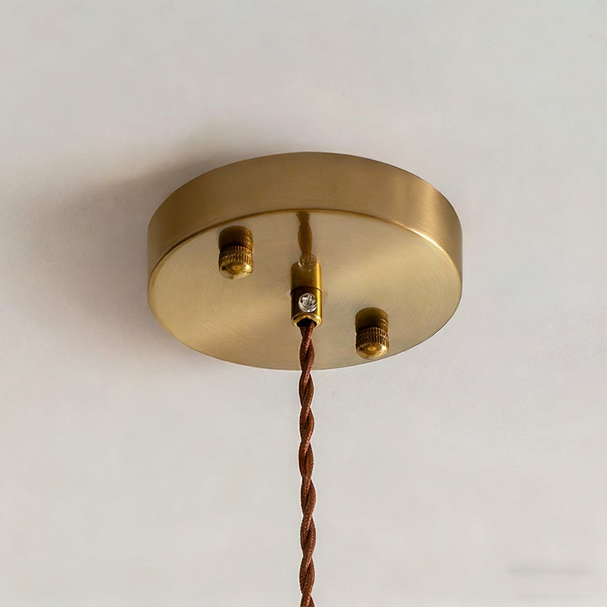 The interior of the Aeron Pendant Light showing the E26/E27 bulb base.