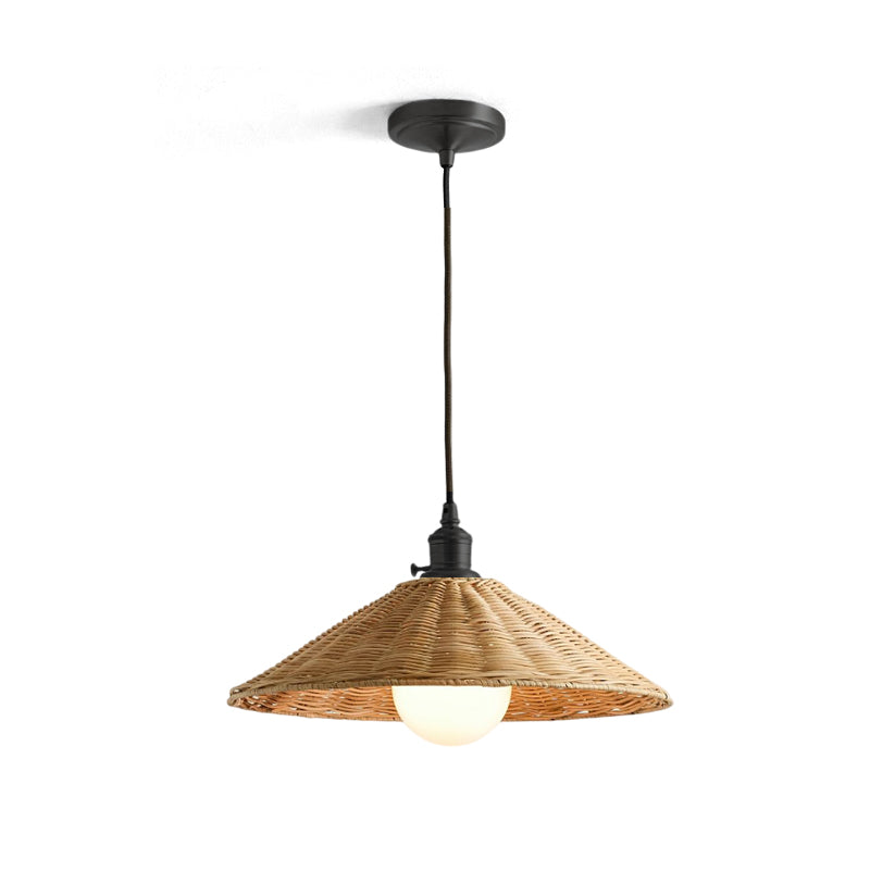 The Agoura Pendant Light illuminating a cozy reading nook.