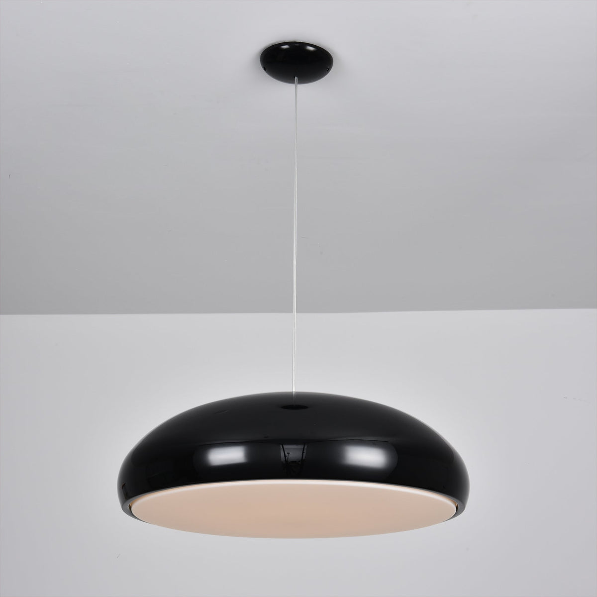 Aicia Pendant Light hanging over a dining table.