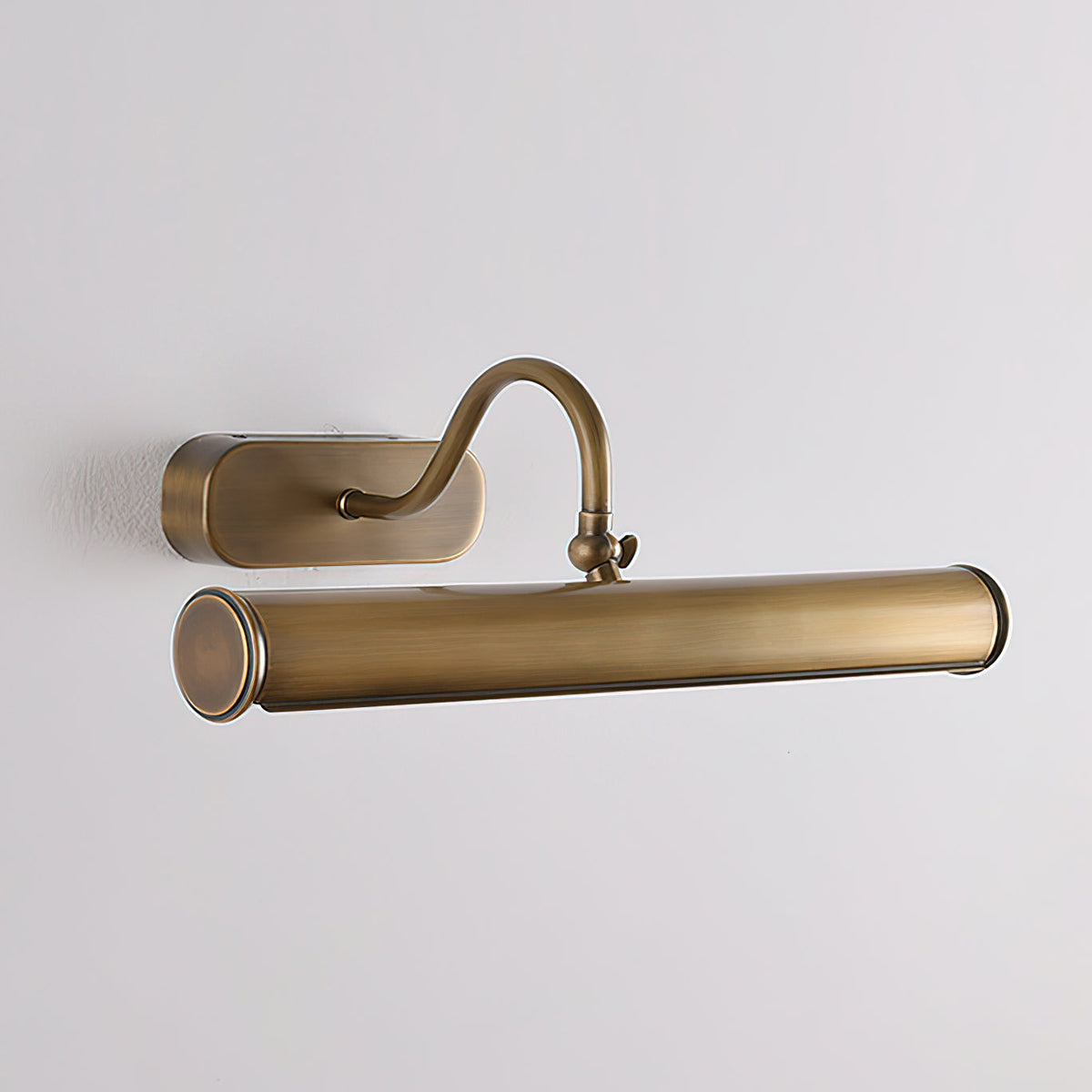 Lifestyle image of the Ainsworth Brass Wall Sconce in a chic living room.