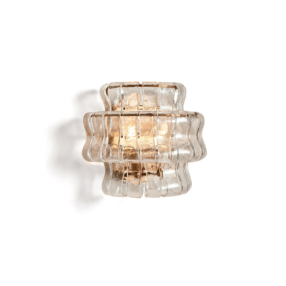 Albano Wall Lamp in clear glass against a neutral wall.