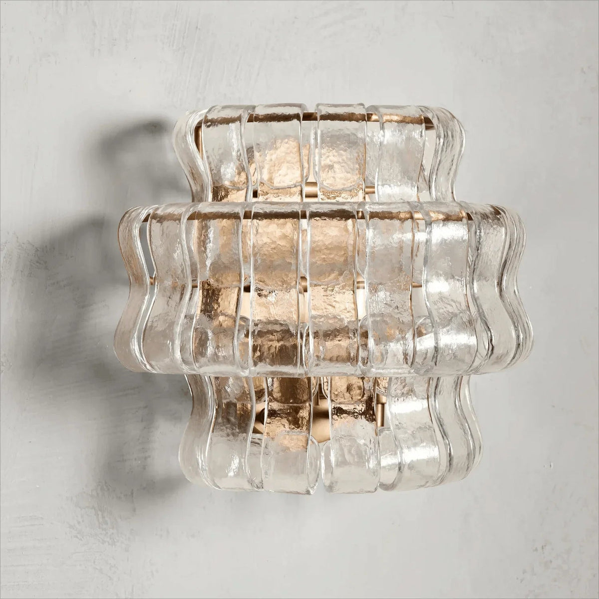 Green glass Albano Wall Lamp as a jewel-toned accent piece.