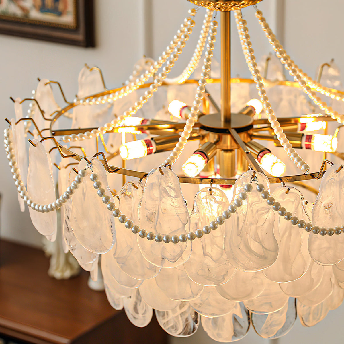 Alessia Chandelier illuminated, casting a warm and inviting glow.