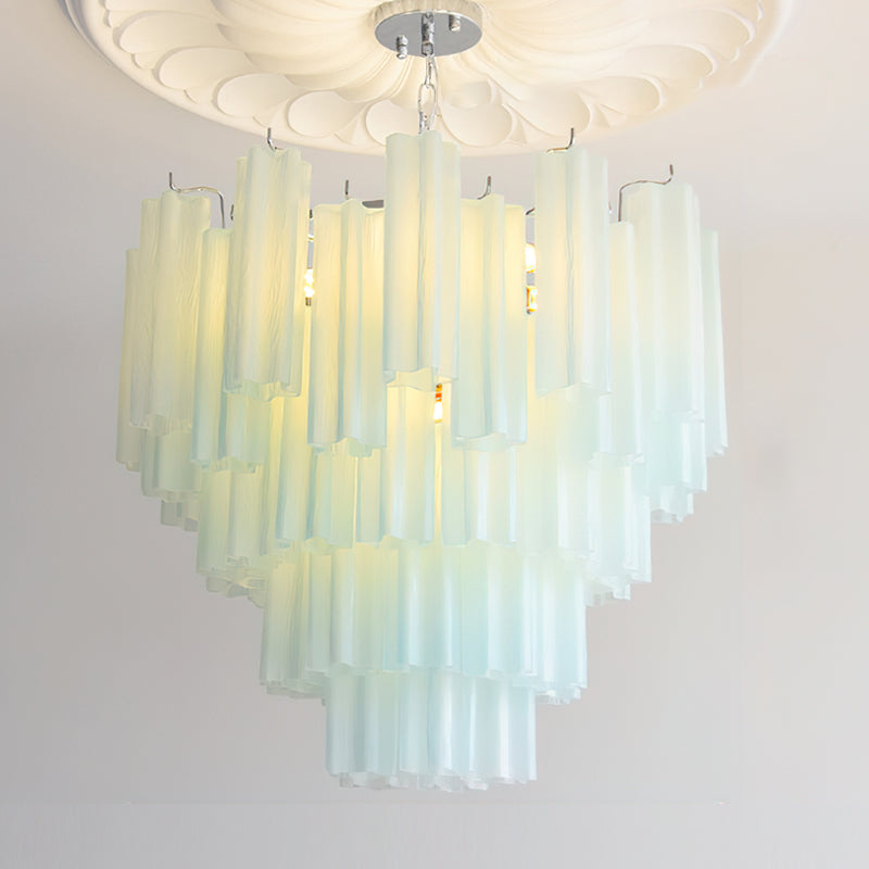 The Alistair Chandelier hanging over a dining table.