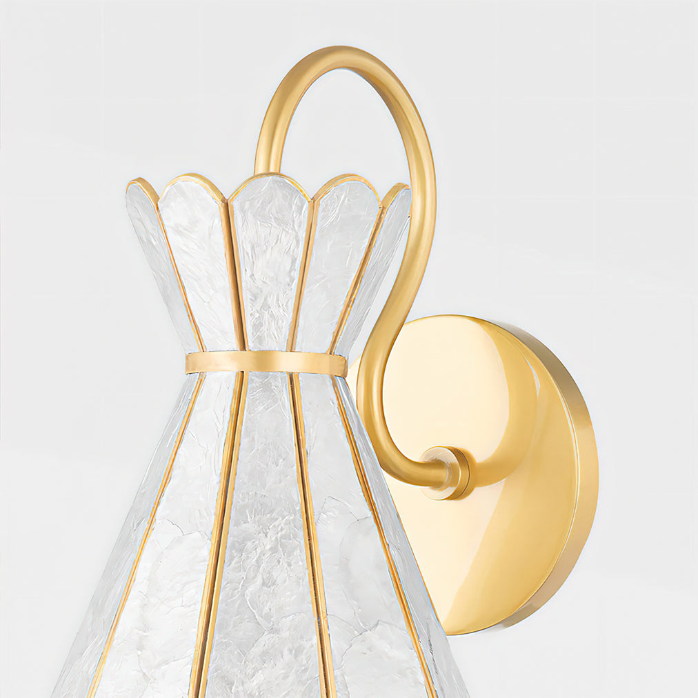 The Alito wall light turned on, casting a warm glow through the translucent shell.