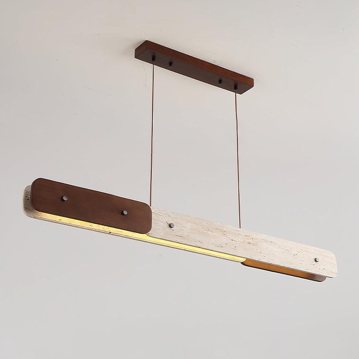 Close-up view of the Aluet Linear Chandelier's natural travertine stone texture.