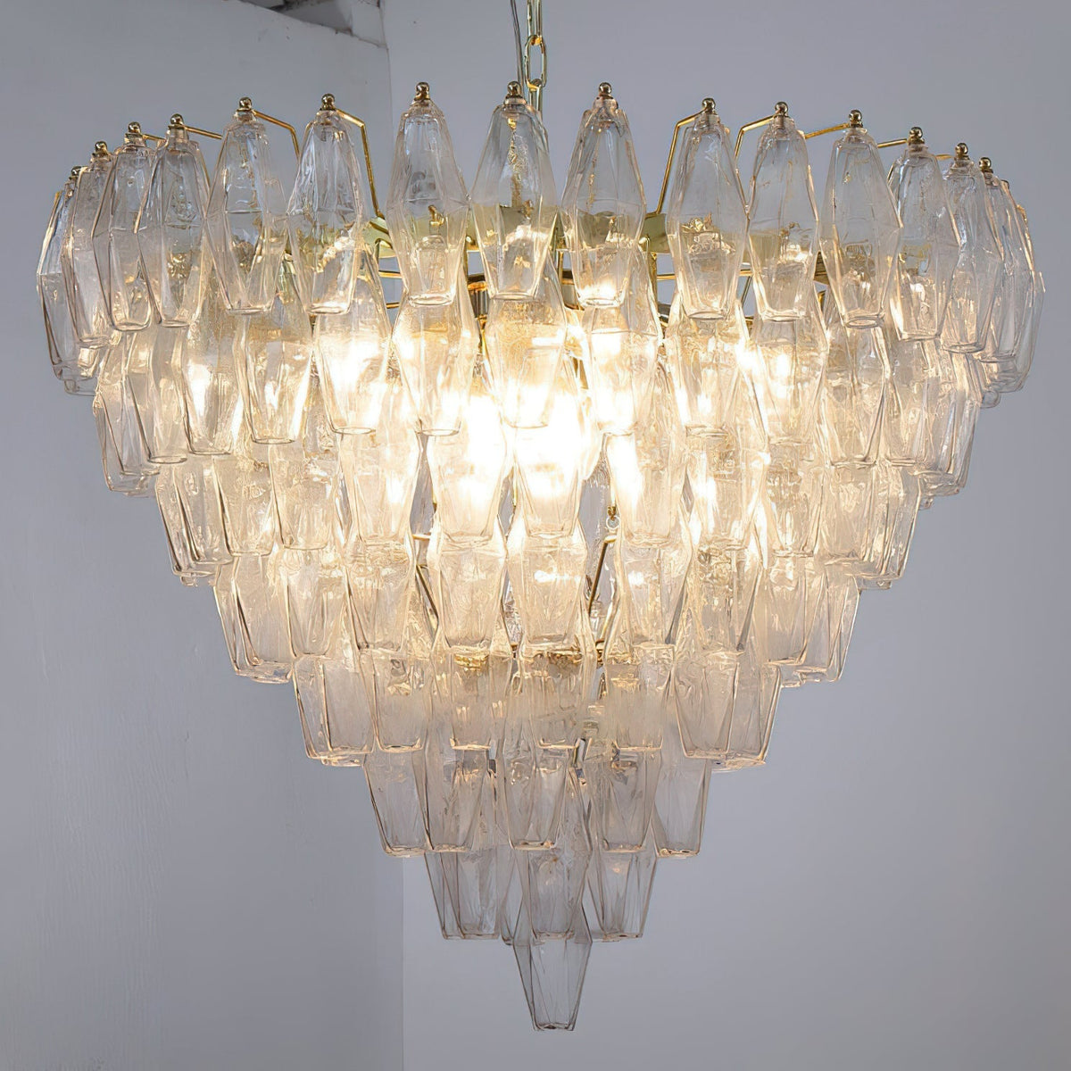 Ametista Chandelier with amber glass prisms in a luxurious lounge.