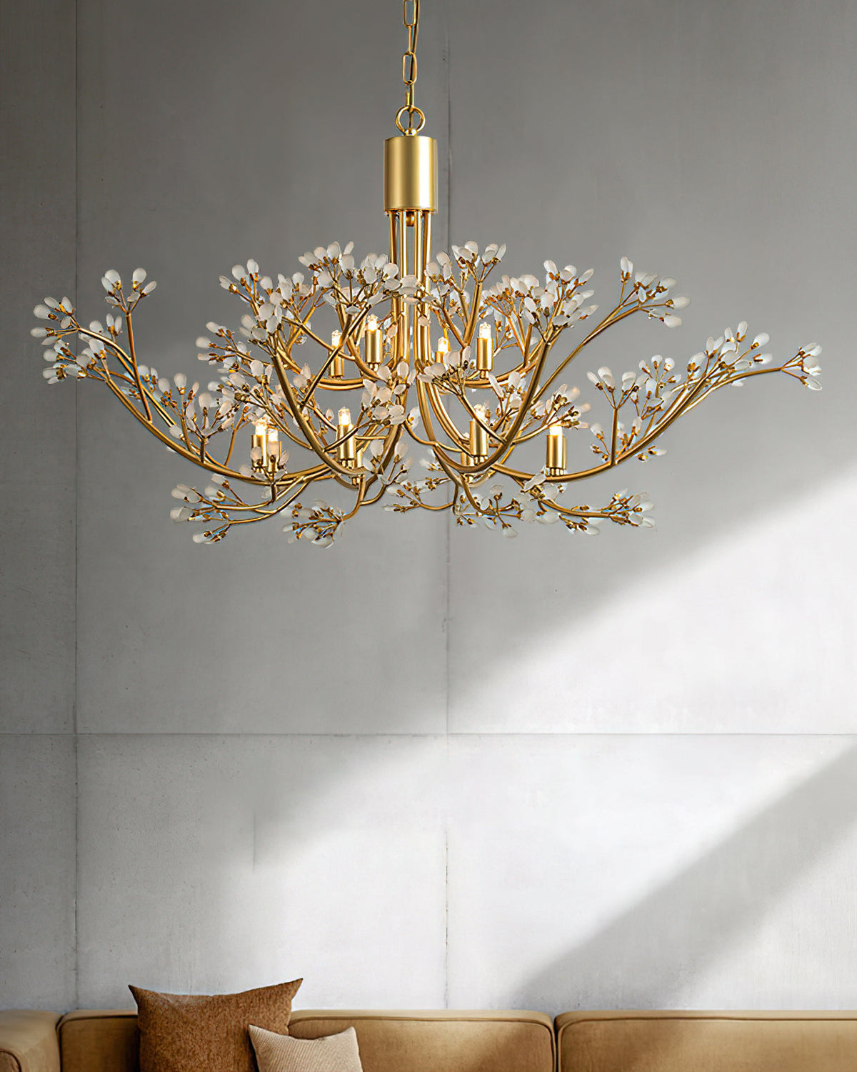 The Anais Crystal Chandelier illuminated in a modern living room.
