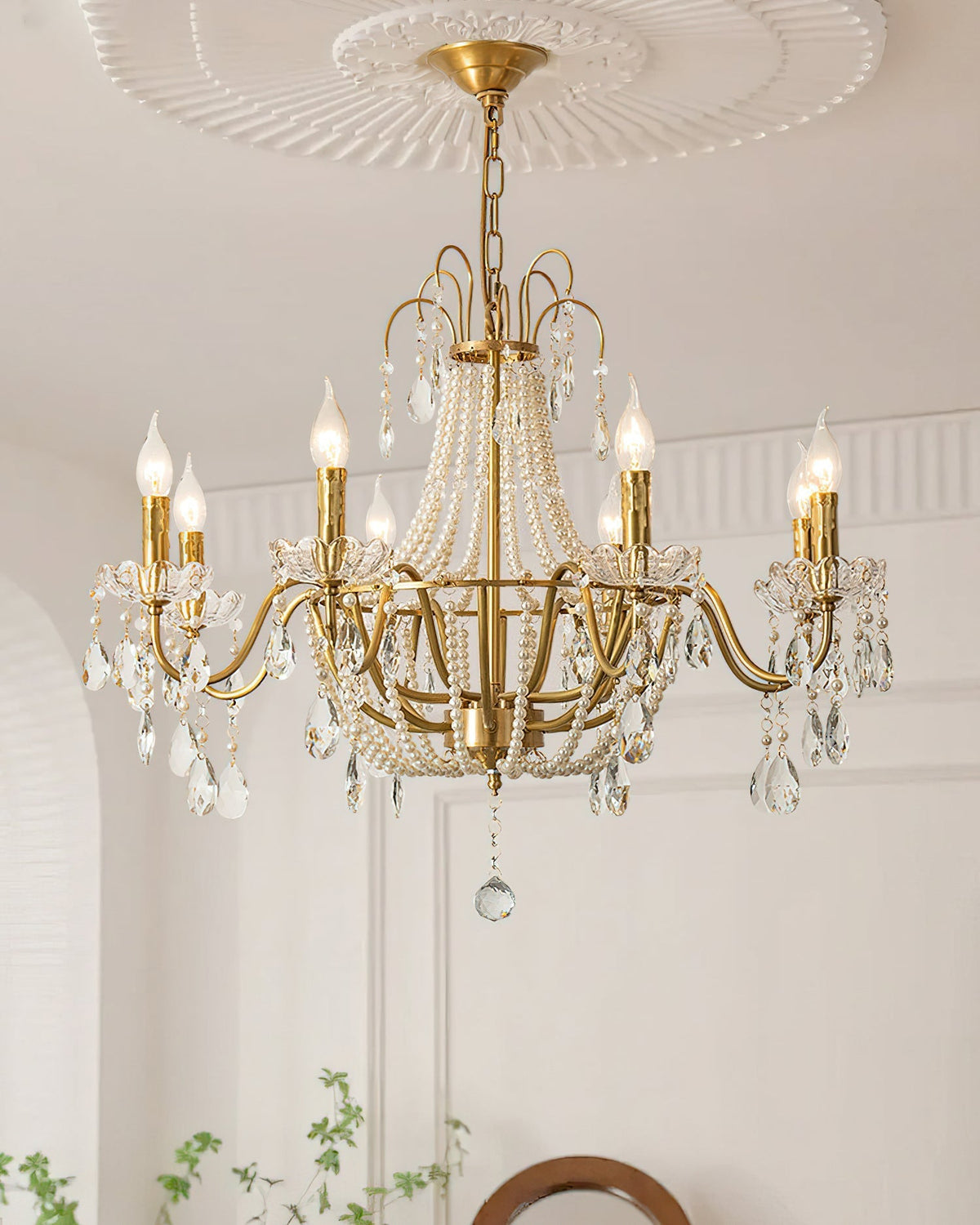 Detail shot of the gold metal framework of the Arcadia Chandelier.
