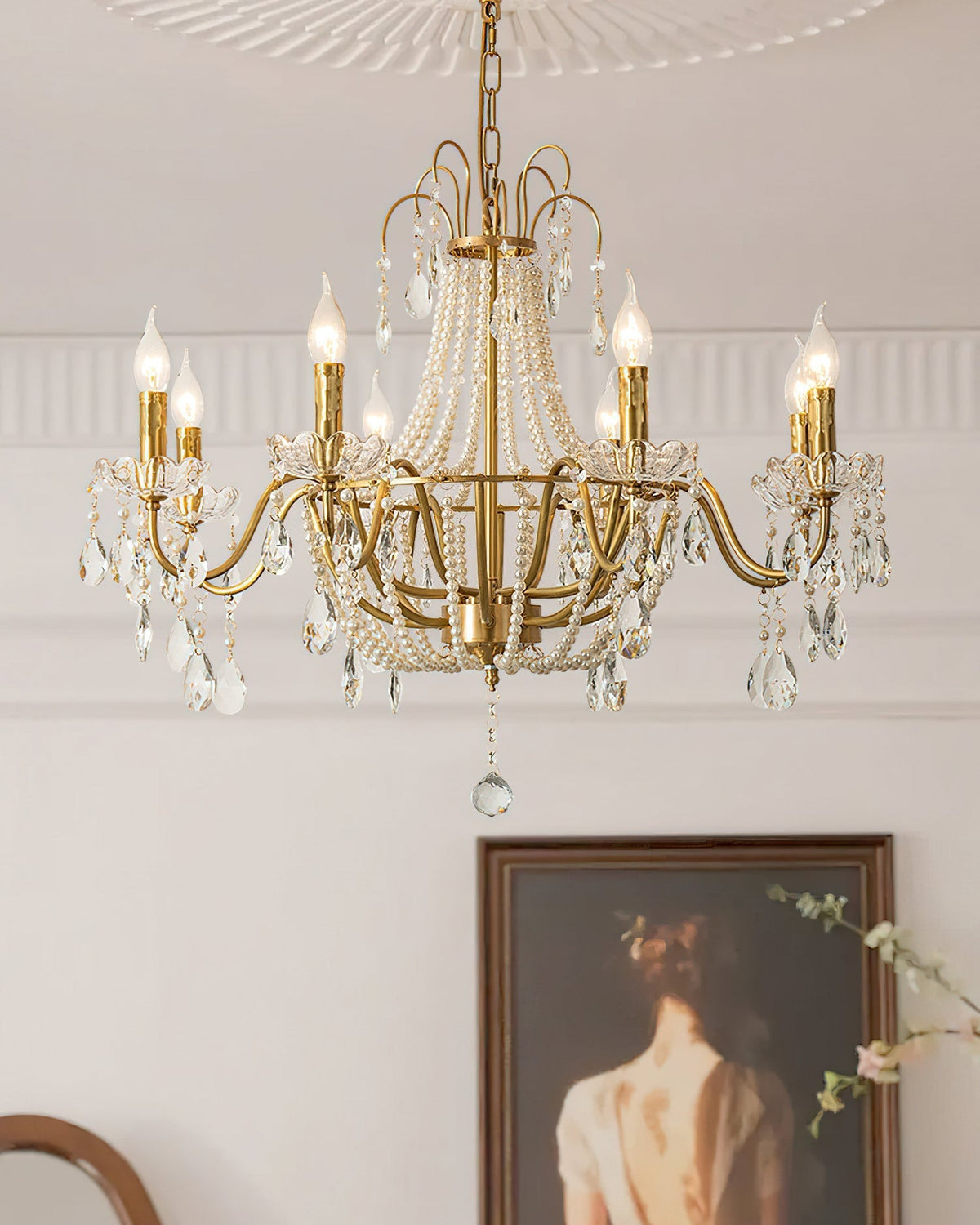 The Arcadia Crystal Chandelier hanging above a dining table.