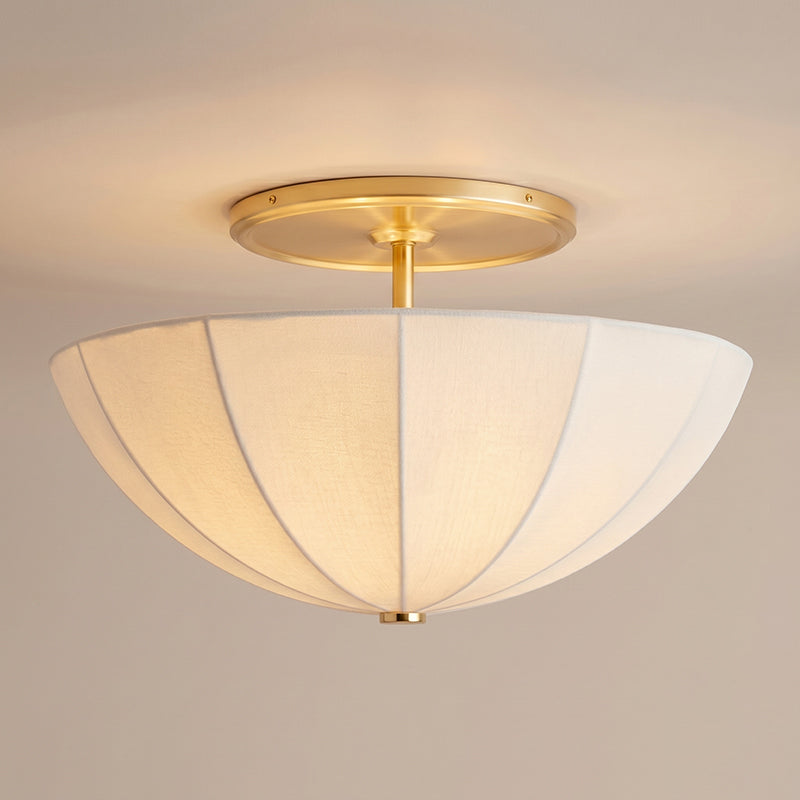The Auden light fixture installed in a luxurious walk-in closet, providing ambient lighting.