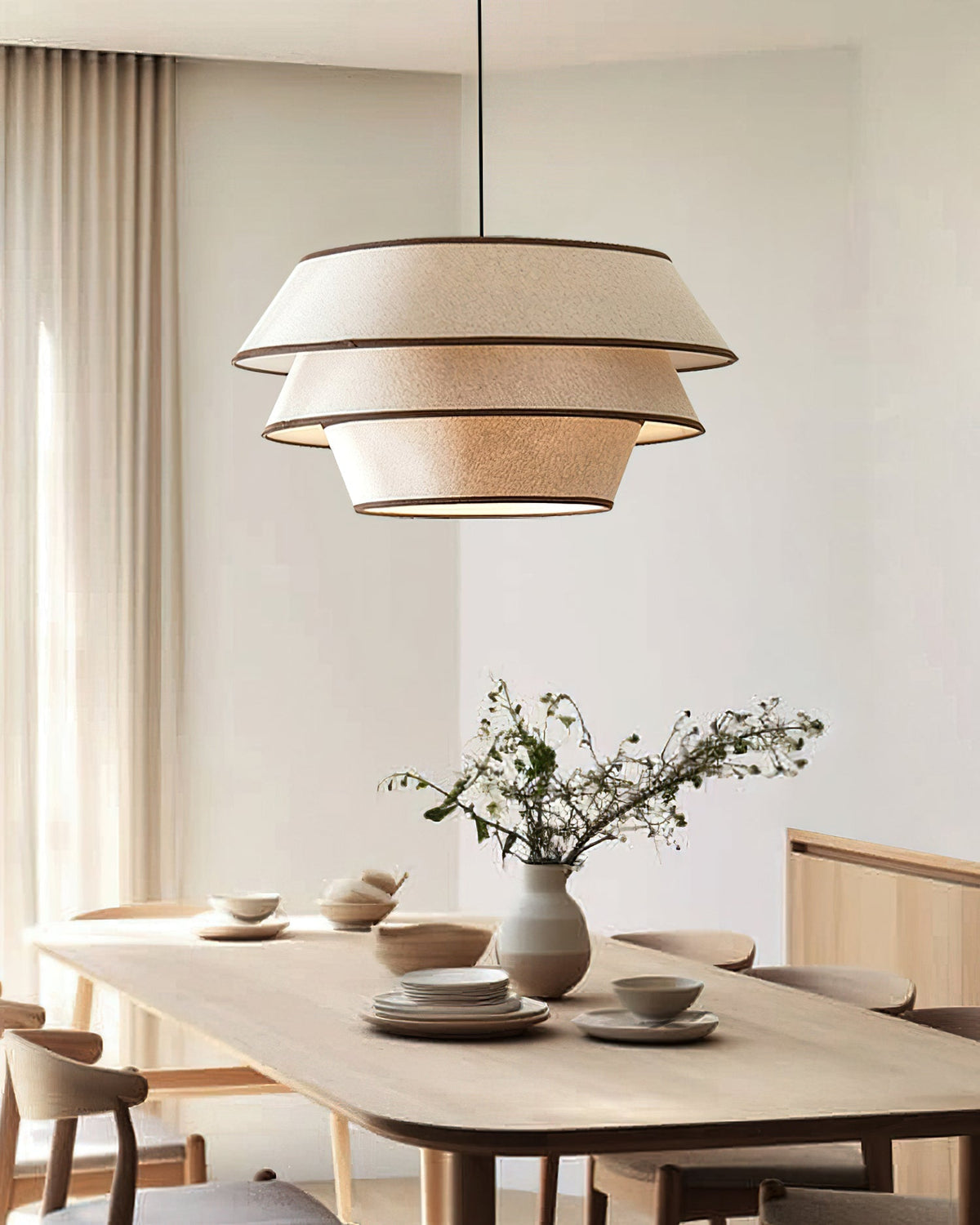 The Auden Pendant Light shown with mid-century modern furniture.