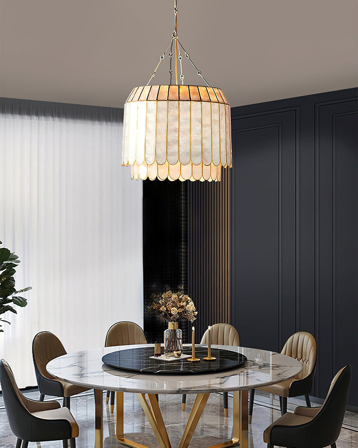 Lifestyle image of the Aurelia lamp in a modern coastal-style bedroom.