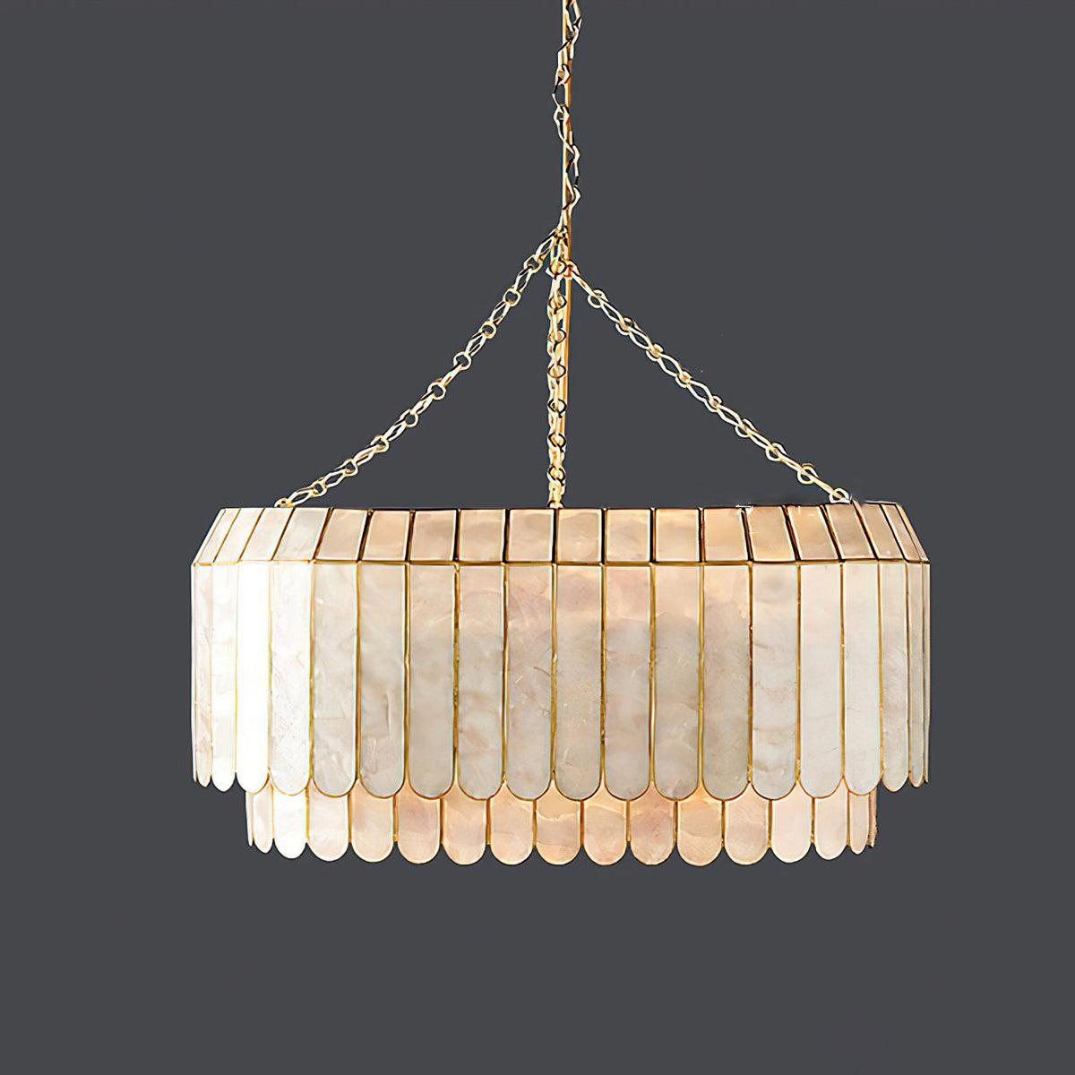 Side view of the large Aurelia Capiz Pendant Lamp, highlighting its scalloped pattern.