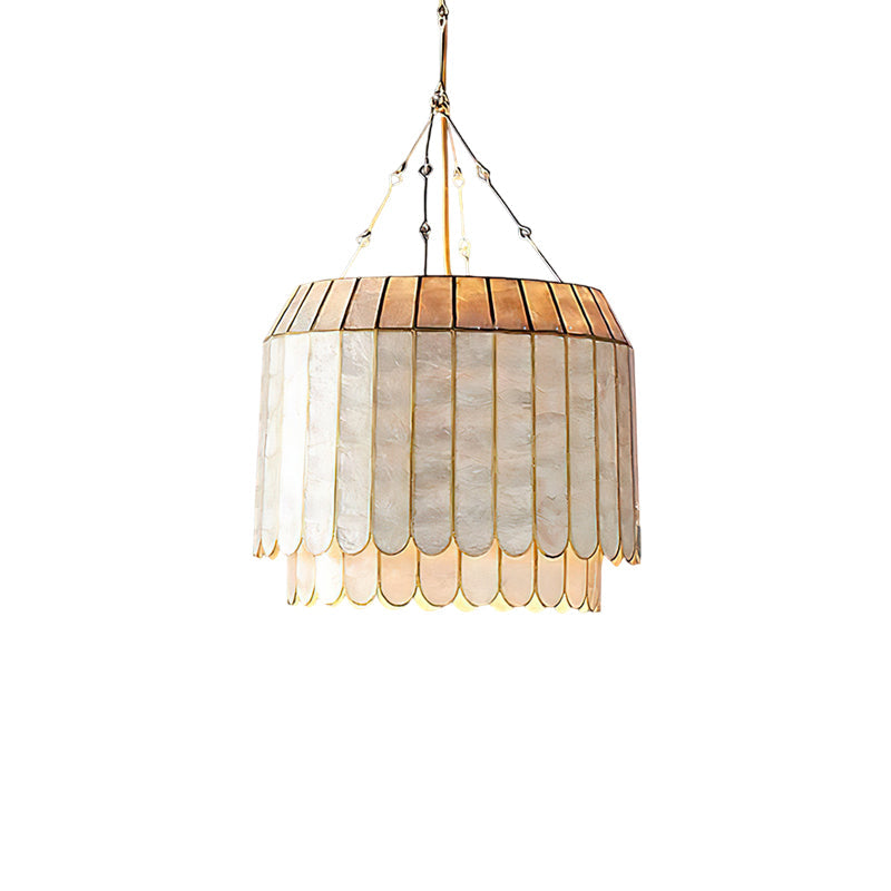 The Aurelia lamp as a statement piece in a high-ceiling entryway.