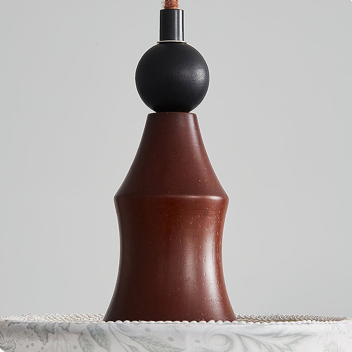The Aurelian Pendant Light illuminated, casting a warm and tranquil glow.