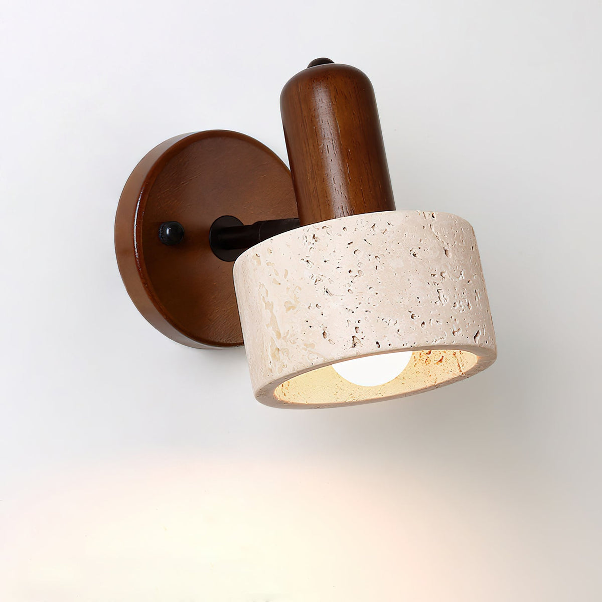 The Aureole Wall Light shown illuminated, casting a warm and inviting glow.