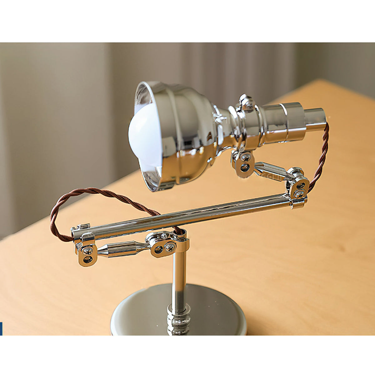 The wall lamp retracted against the wall to save space.