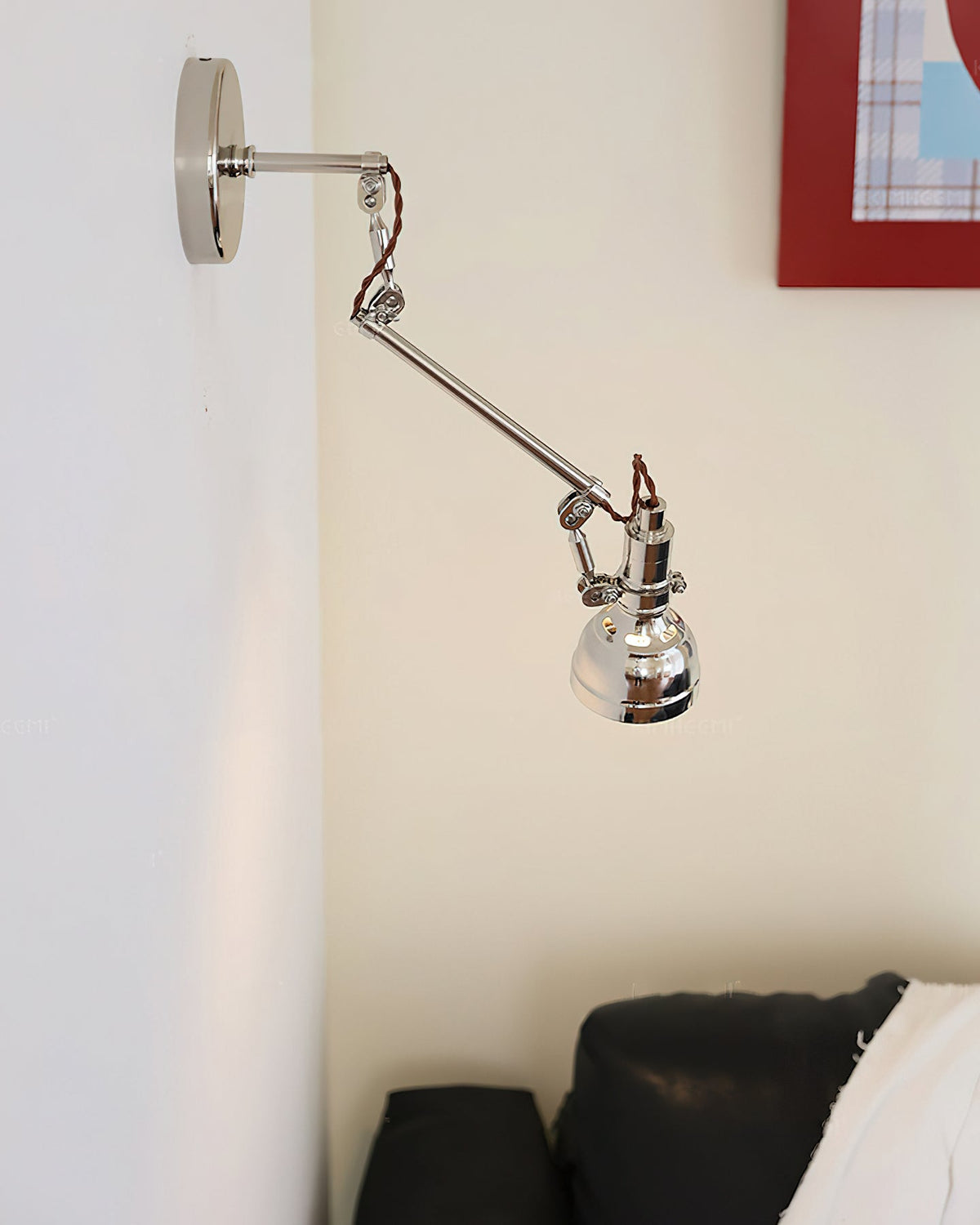 Avonni wall lamp installed in a modern bedroom.