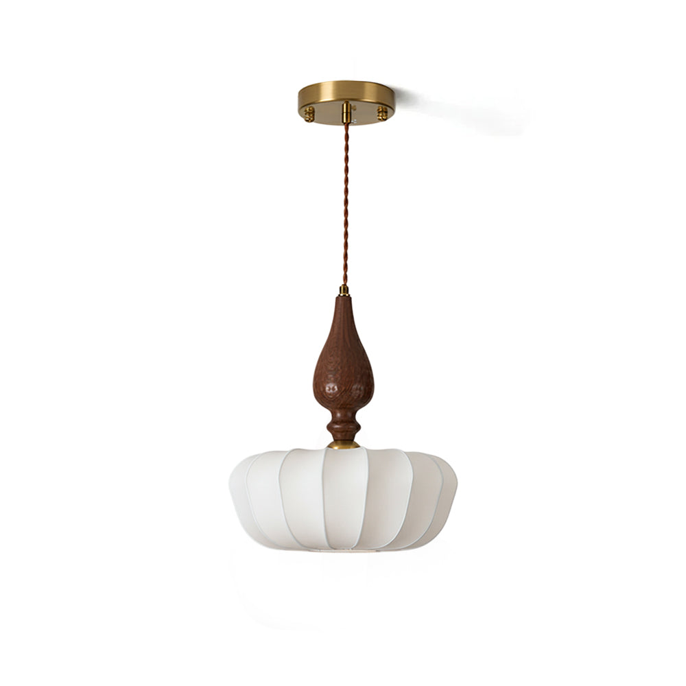Baird Pendant Light with a white silk shade and walnut wood accent.