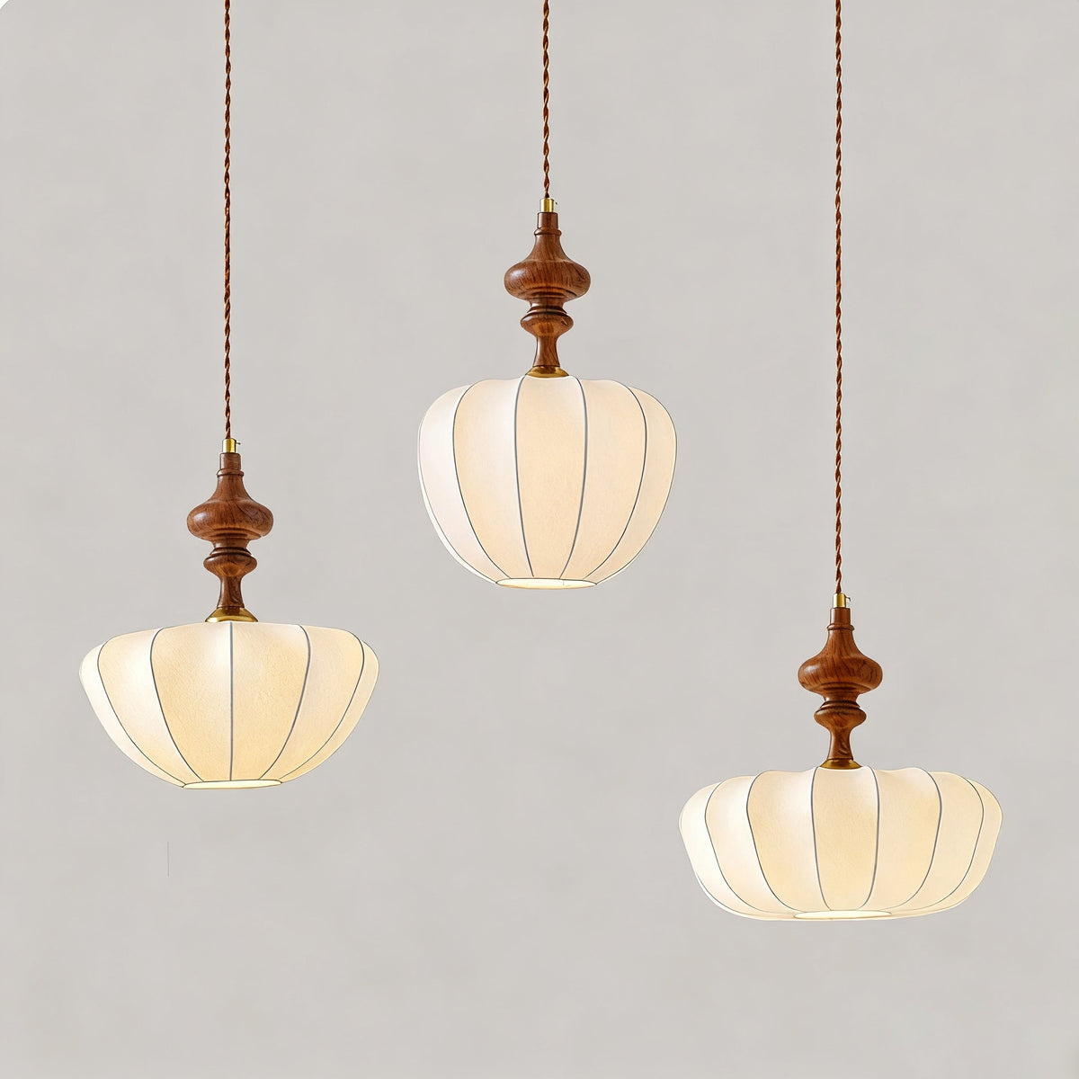 A close-up view of the Baird Pendant Light's pumpkin-shaped shade.