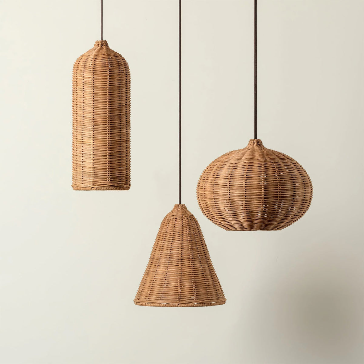 The Beliani rattan pendant light illuminating a modern dining area.