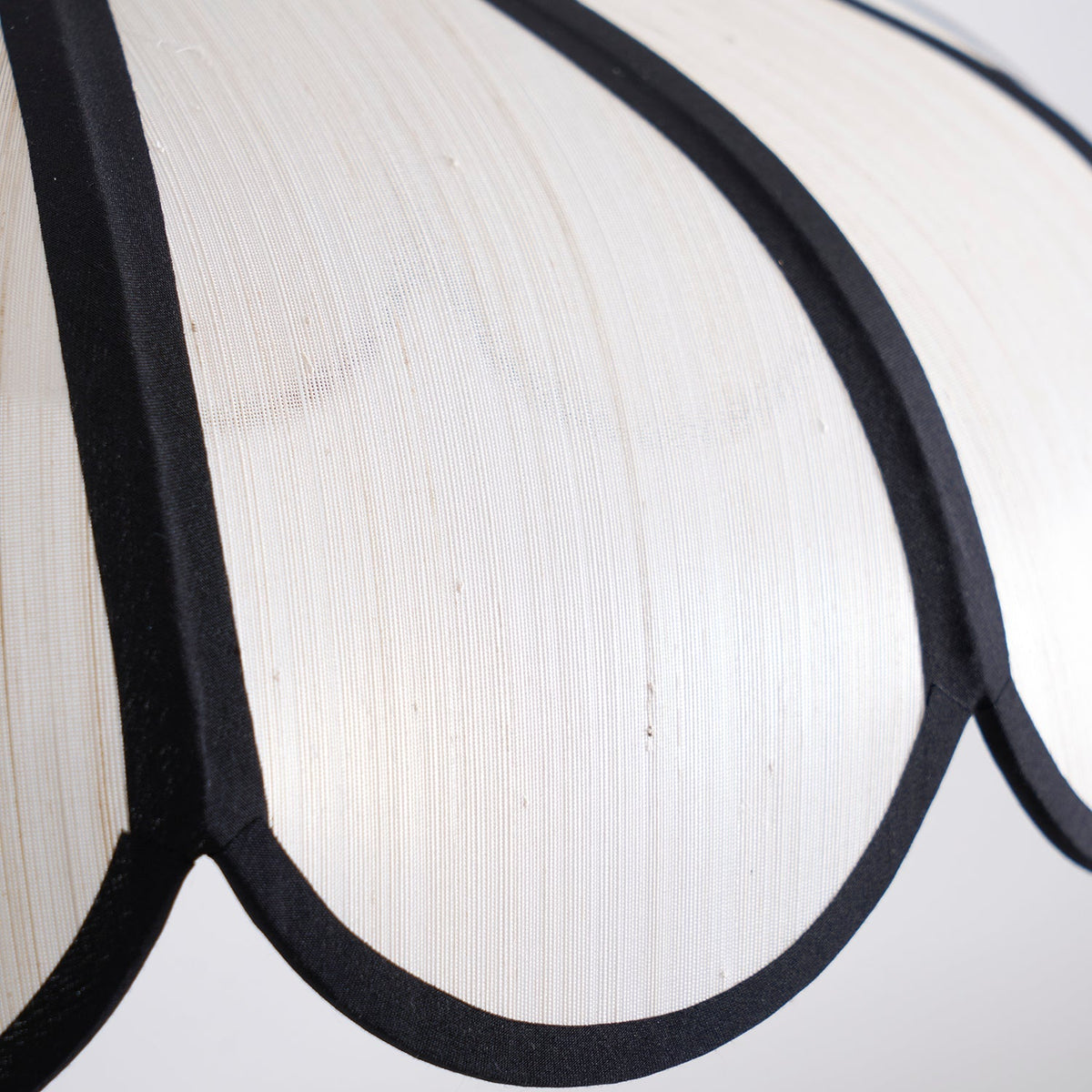 A pair of Botan Pendant Lights hanging at different heights.