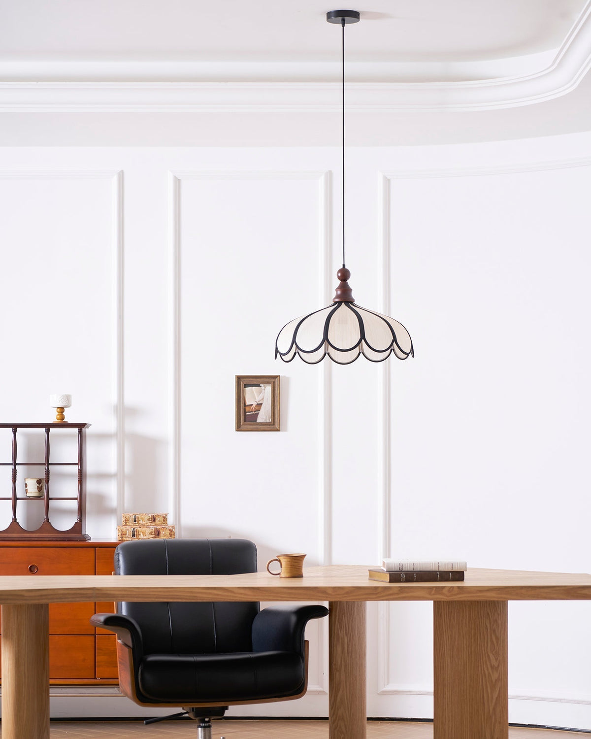 Side profile view of the Botan Pendant Light showcasing its scalloped silhouette.