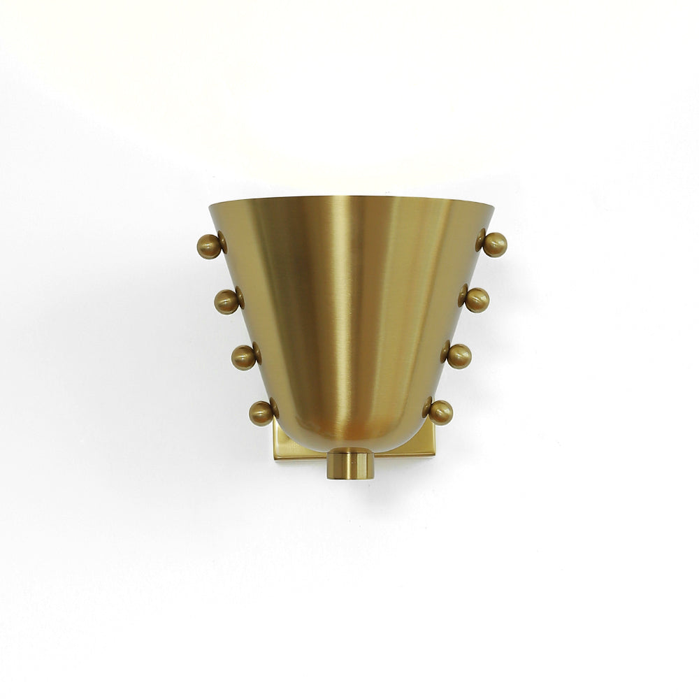 Bespoke wall lamp adding a touch of luxury to a room.