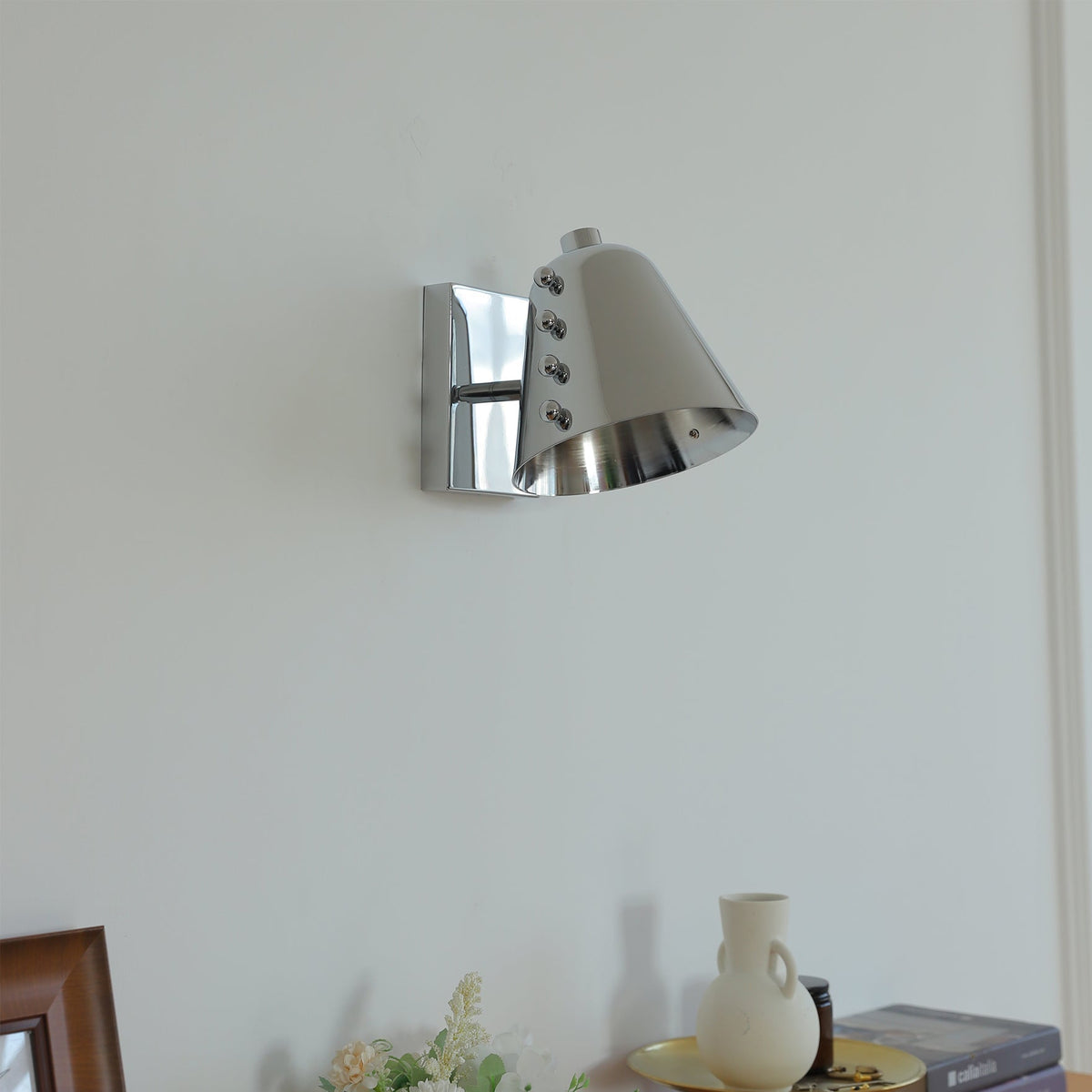 Front view of the Bespoke wall lamp, highlighting its sculptural form.