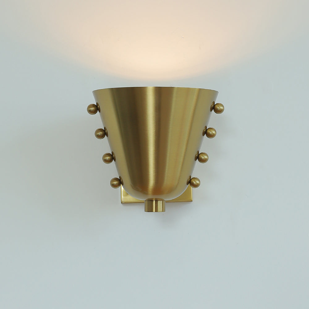 Bespoke wall lamp in a minimalist entryway.