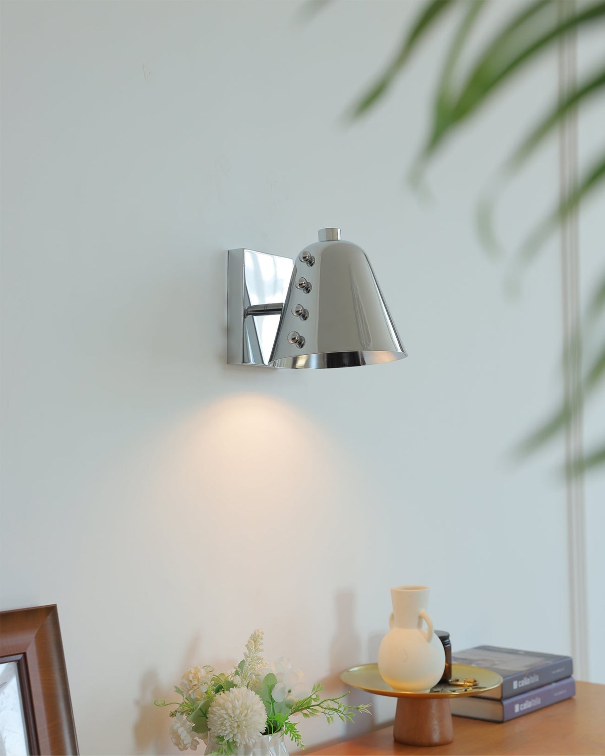 Bespoke wall lamp installed in a sophisticated entryway.