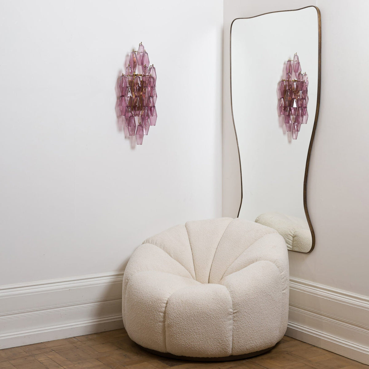 The large version of the Biscayne sconce mounted on a stairwell wall.