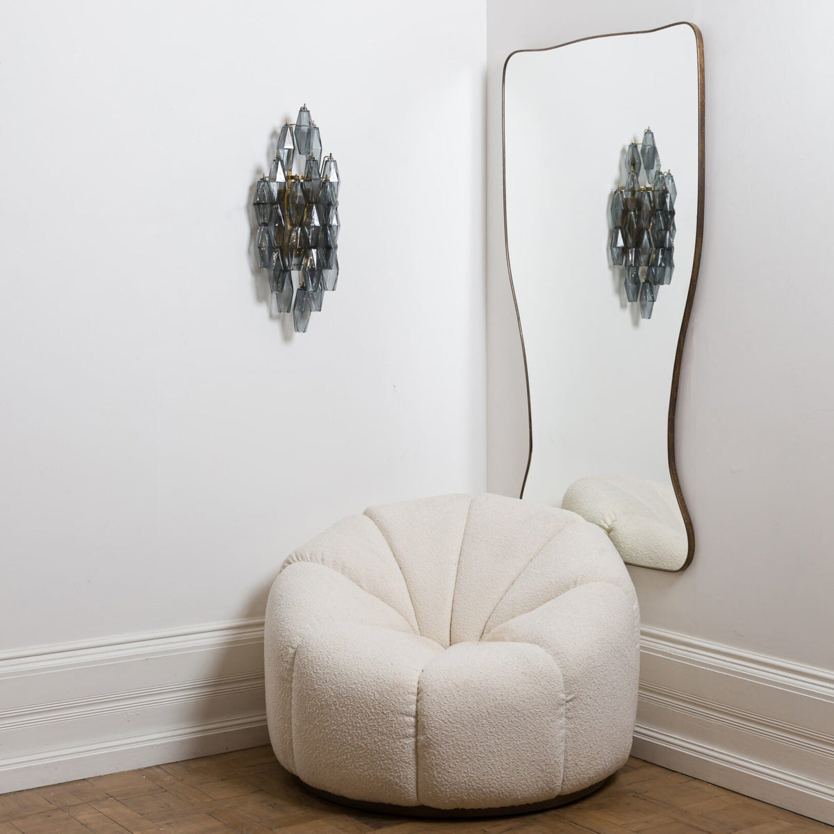 Lifestyle image of the Biscayne sconce in a modern dining room.