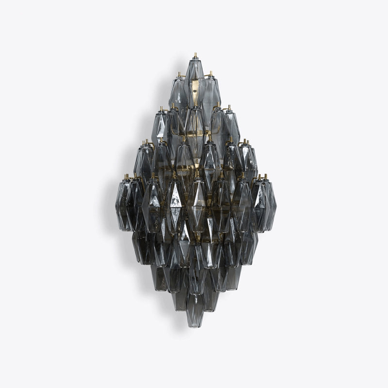 The Biscayne sconce illuminated, showing the light refracting through the prisms.