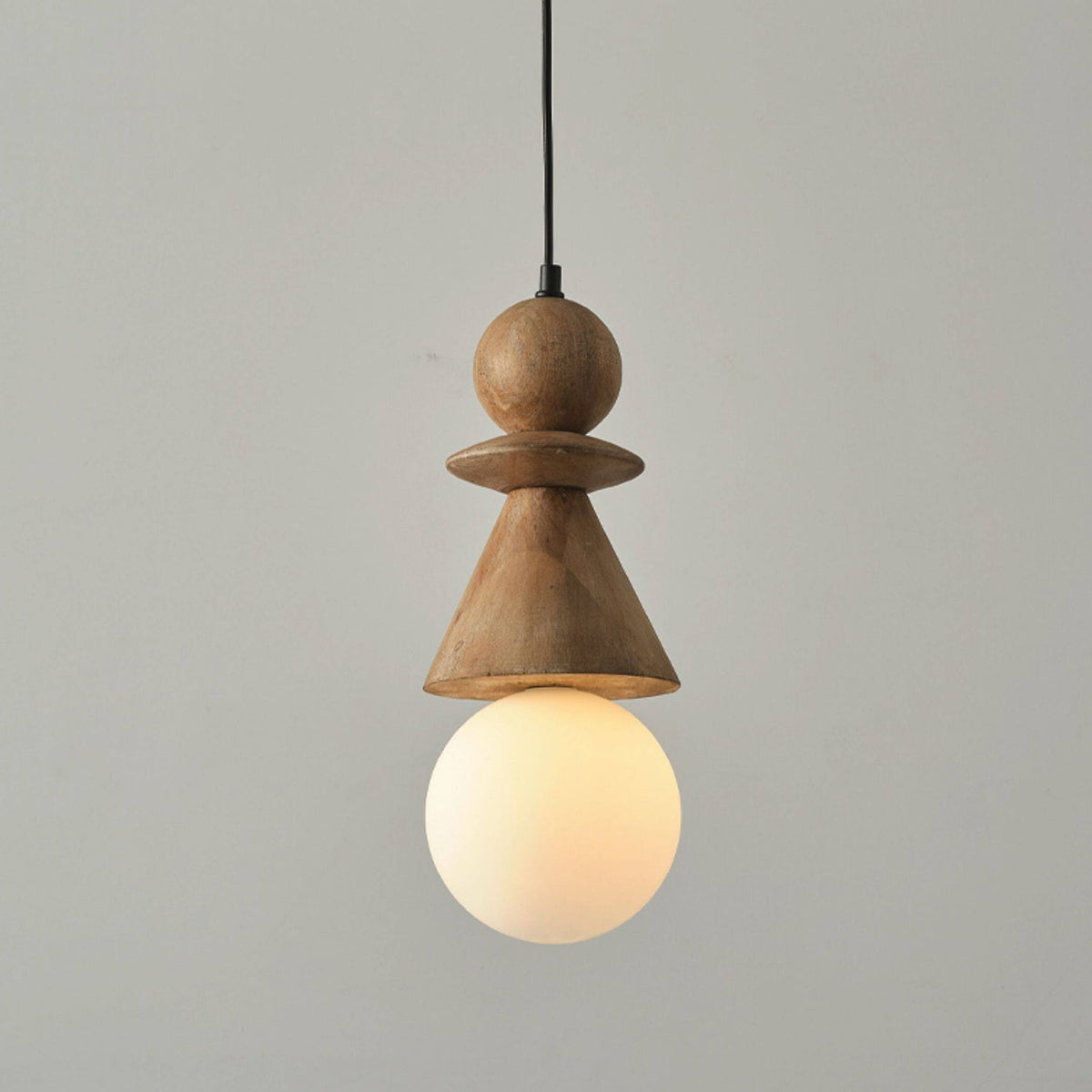 Close-up of the Bodie pendant light showing the hand-carved wood segments.