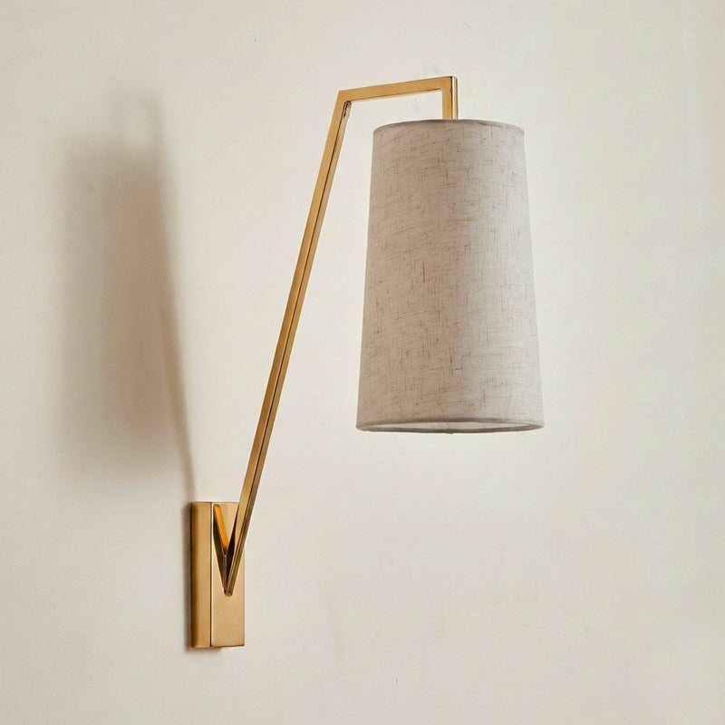 Close-up of the Bonny Wall Light's fabric shade and brass details.