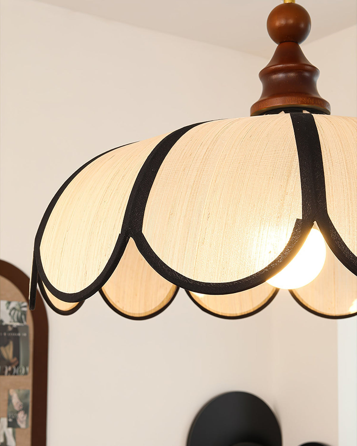 Close-up on the bold black trim that edges the abaca shade.