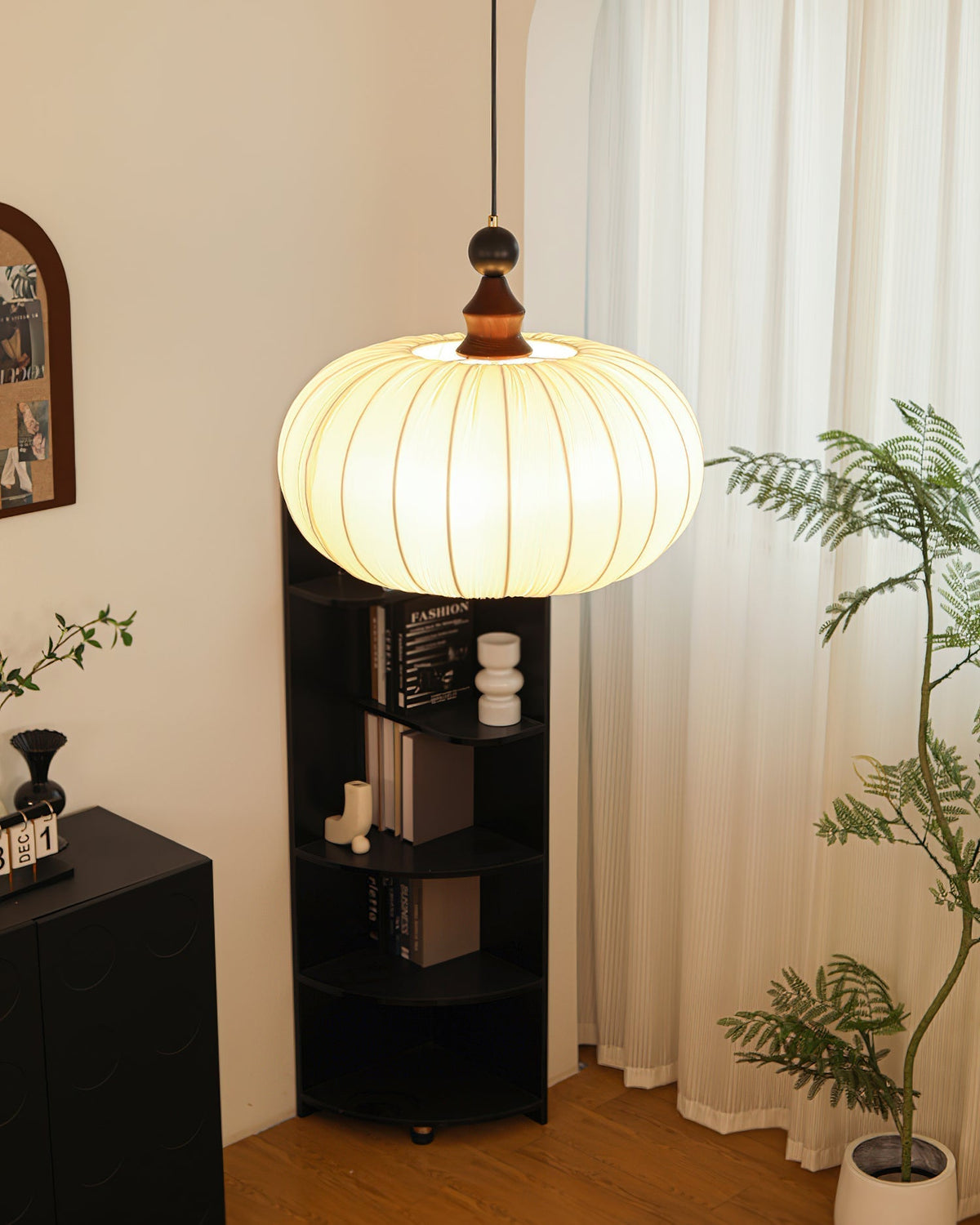 A display showing the three available sizes of the Bowie Pendant Light.