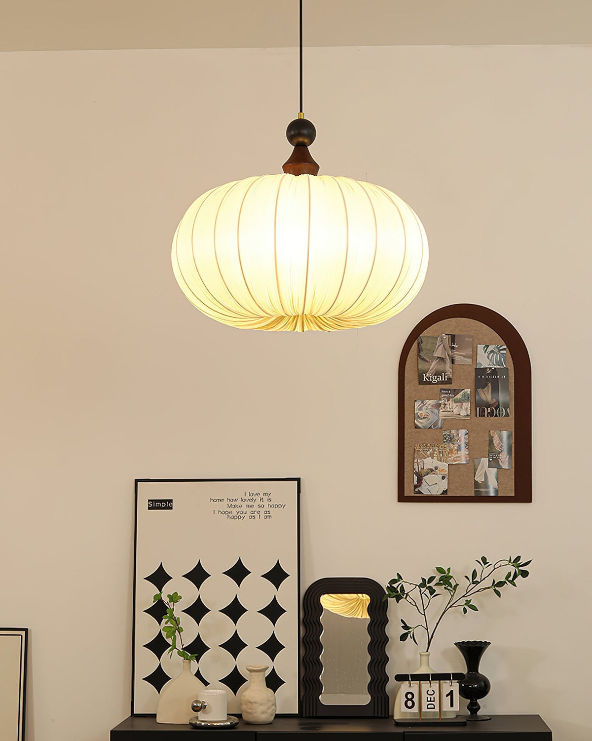 The Bowie Pendant Light illuminated, showing the soft, diffused light through the fabric.