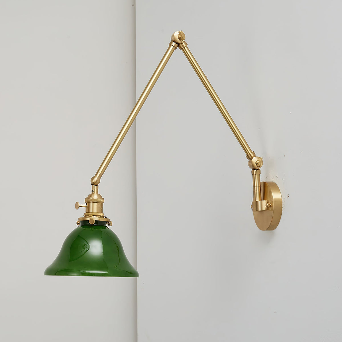 Side view of the Brady wall lamp showcasing its swing arm mechanism.