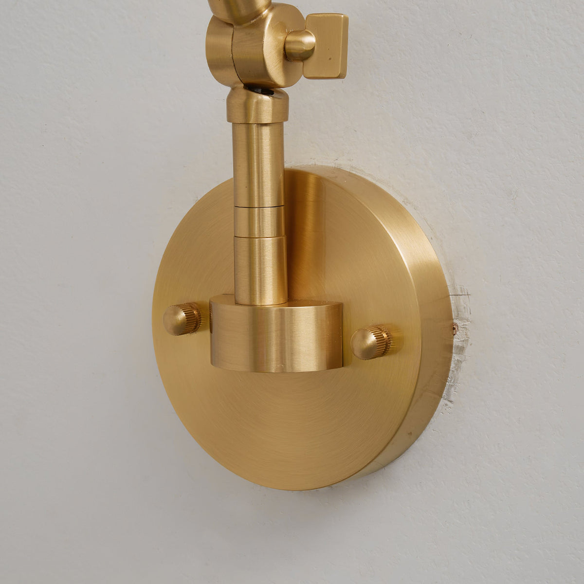 Brady Swing Arm Wall Lamp with an LED bulb installed.