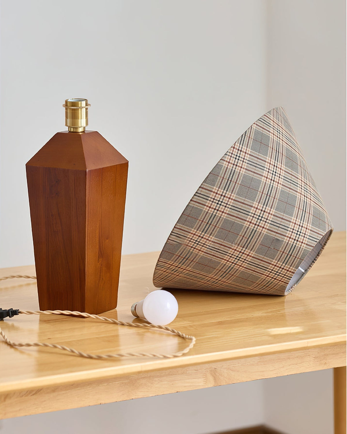 Detail shot of the solid wood base with a walnut finish.