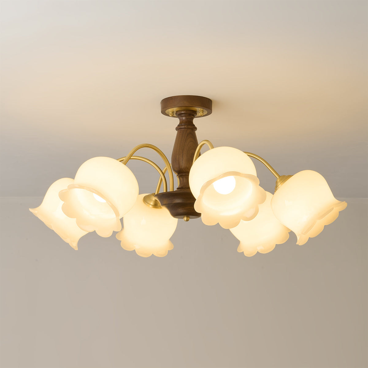 Close-up of a glass flower shade on the Cacier Chandelier.