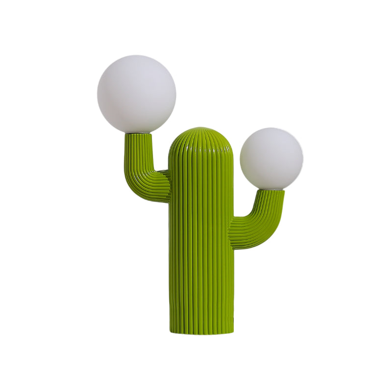 Lifestyle image of the Cactus Table Lamp on a bookshelf.