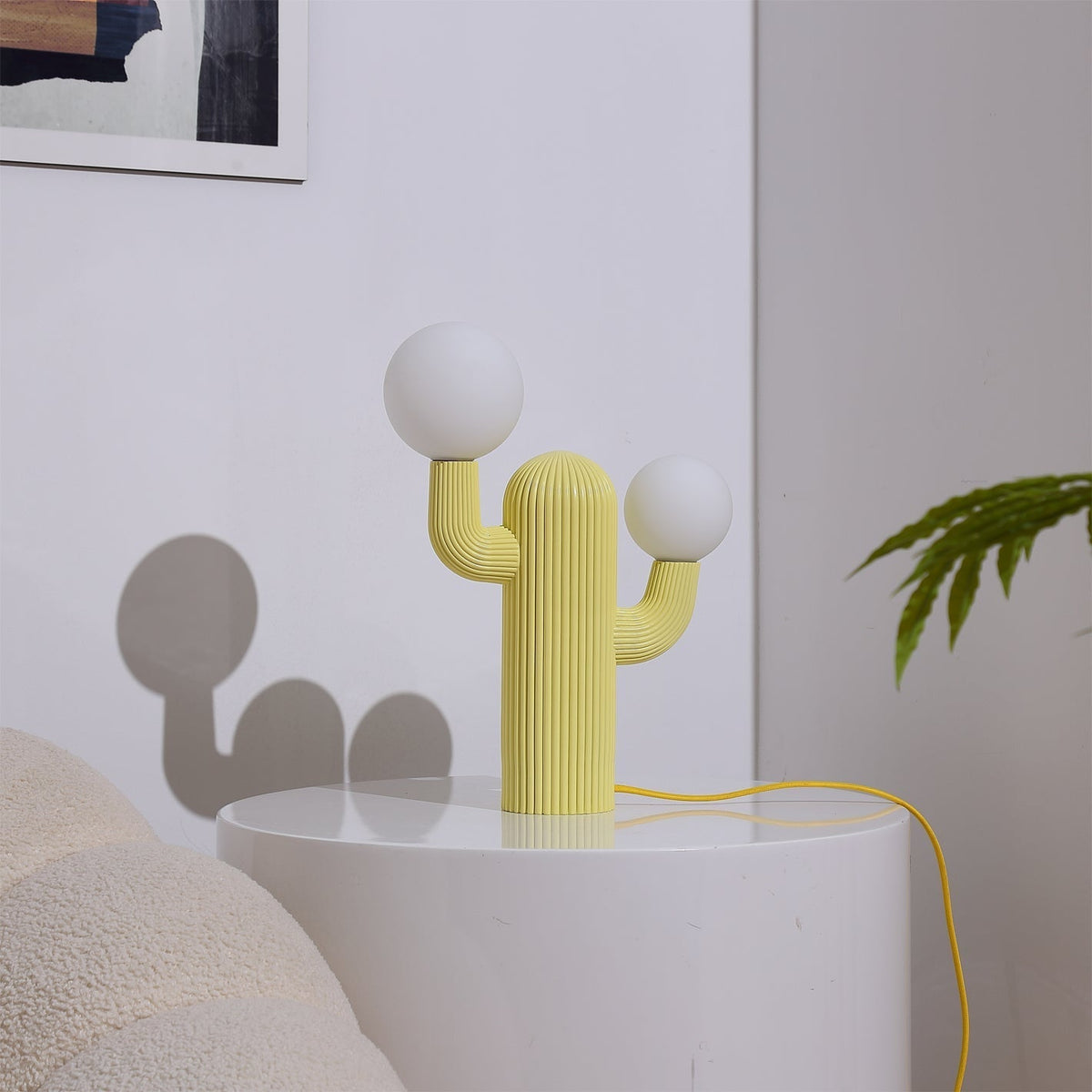 All three color options of the Cactus Table Lamp: green, light green, and yellow.