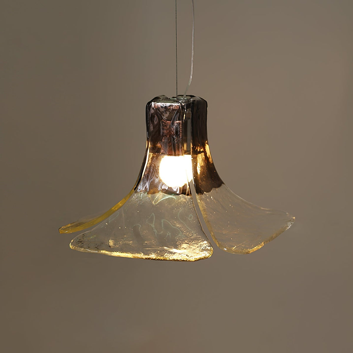 Close-up on the texture of the smoky gray glass shade.