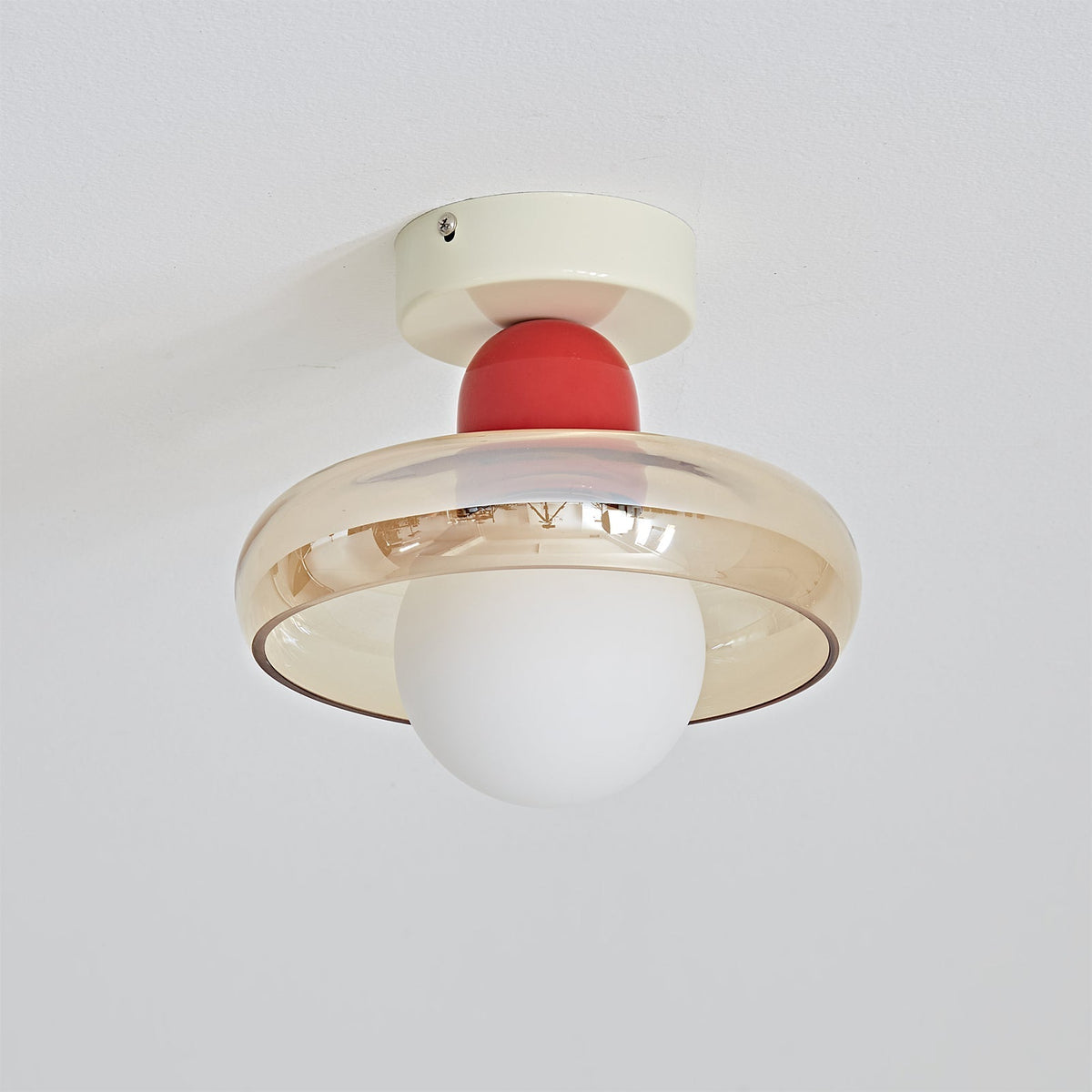 The Alabax Ceiling Light unlit, showcasing the glass color.
